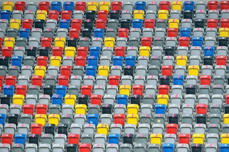 Colourful seating shells in the empty Merkur-Spiel-Arena
