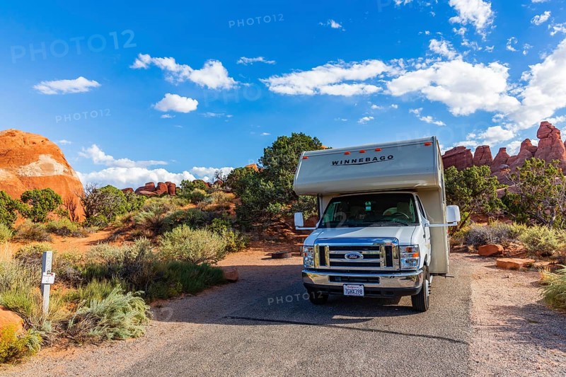 Motorhome in front of rock scenery