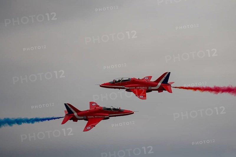 BAE Systems Hawk two aircraft of the Royal Air Force Red Arrows display team in flight