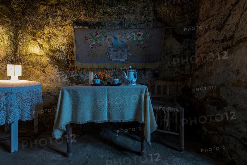 Set table and chair in a cave dwelling
