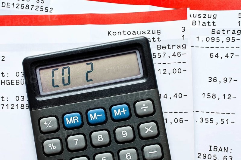 Calculator with the writing CO2 and bank statements