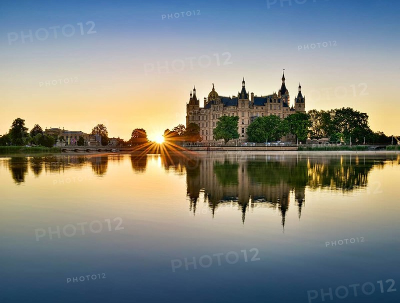 The Schwerin Castle at the Schwerin Lake at sunrise