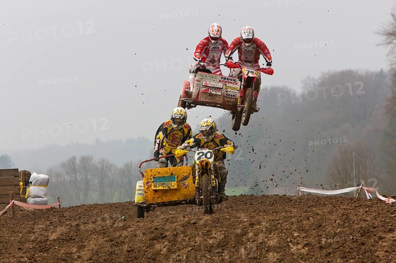 Motorcycle team in the air during a motocross race