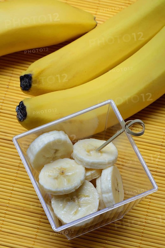 Banana slices in peel and bananas