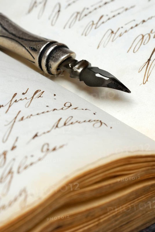 Pen with nib on book