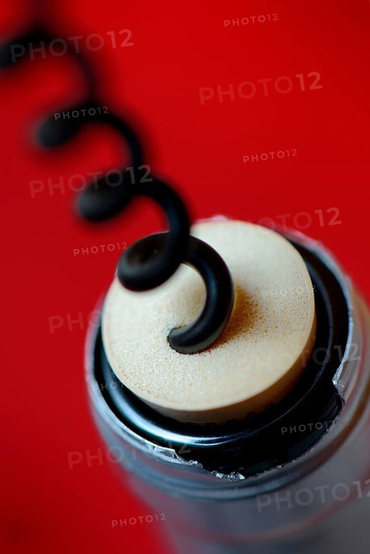 Corkscrew and wine bottle