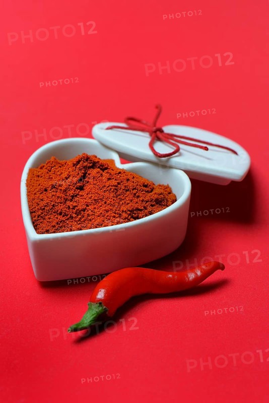 Chili powder in bowl with heart shape