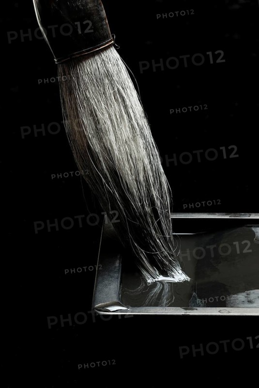 Brush and rubbing stone