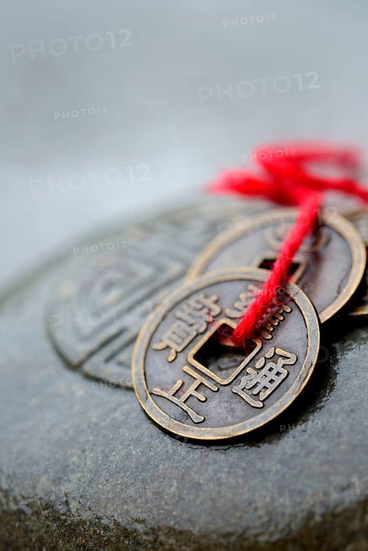 Chinese lucky coins on stone with seal