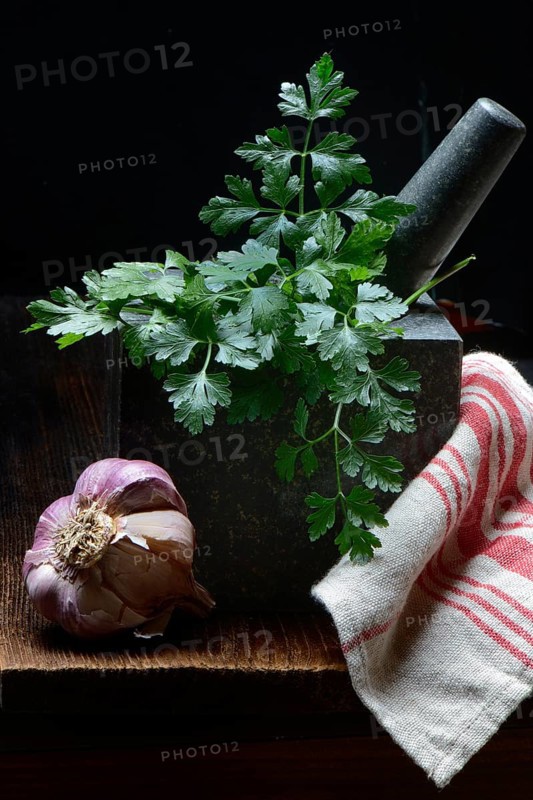Smooth parsley in grated shell and garlic bulb