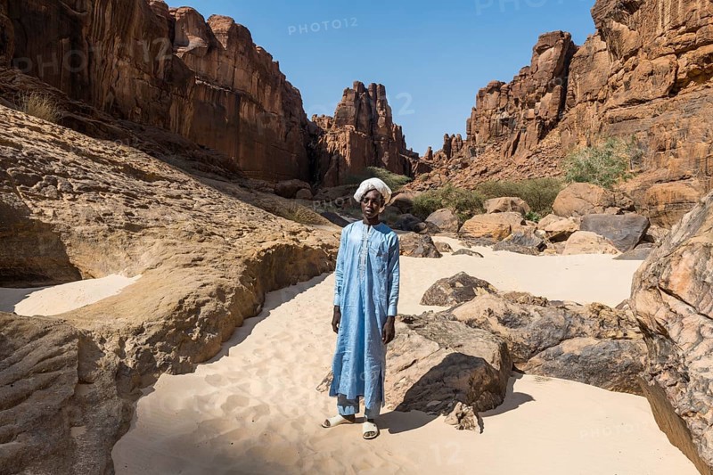 Young Beduin in traditional clothes at Guelta d'Archei waterhole