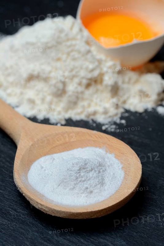 Baking powder in cooking spoon