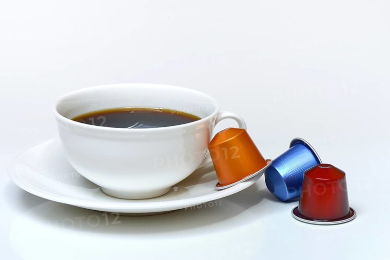 Coffee capsules and coffee cup with coffee