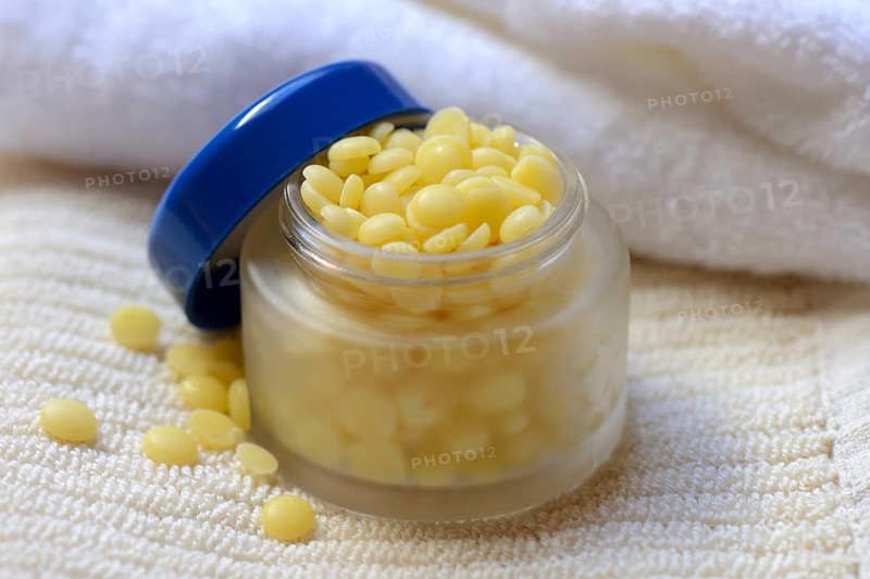 Cocoa butter in glass jar