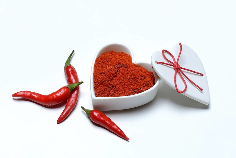Chili powder in bowl with heart shape