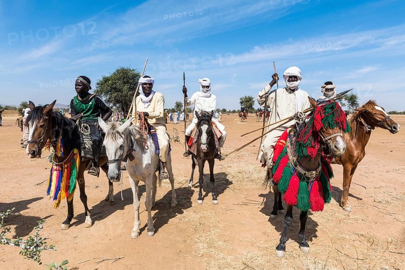 Colourful horse riders at a Tribal festival