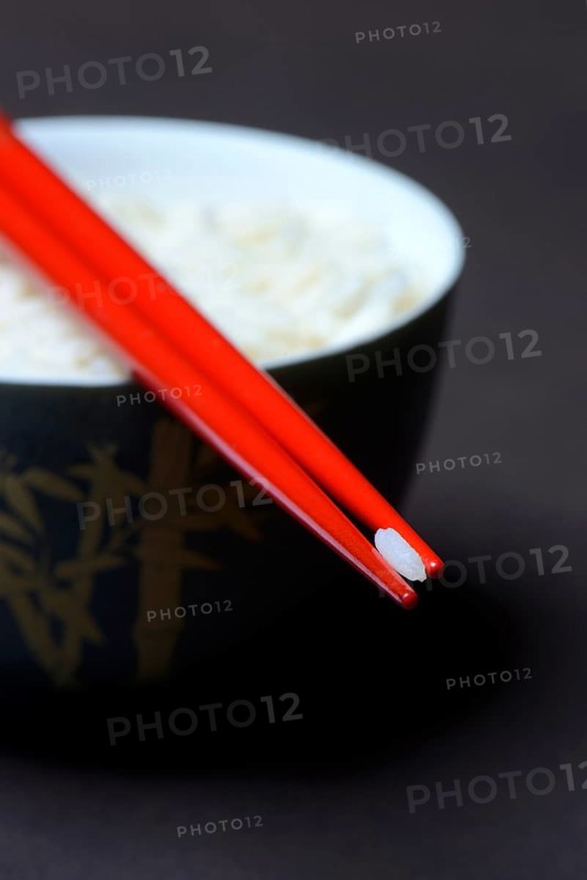 Rice grain on chopsticks