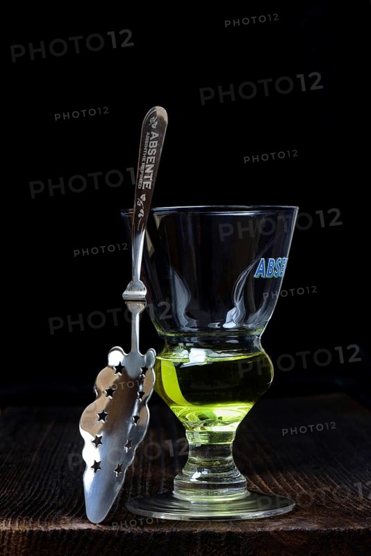 Glass of absinthe with absinthe spoon