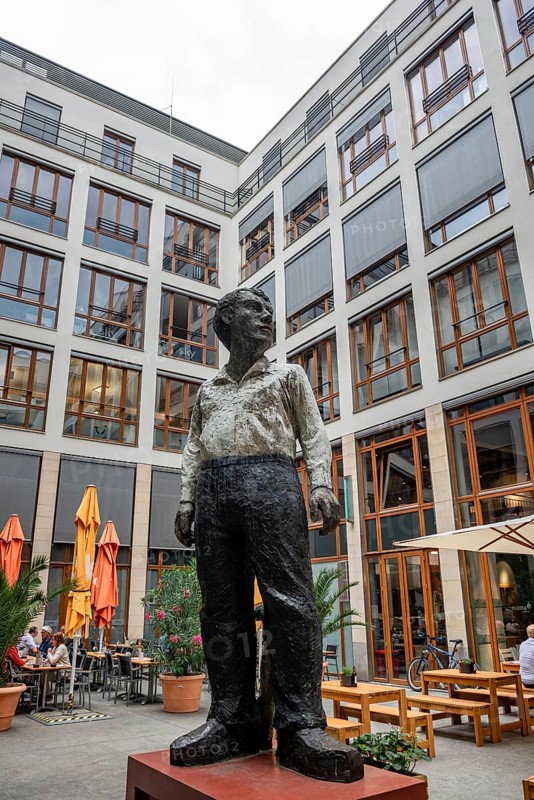 Statue of a man in the courtyard of the Theodor Tucher restaurant near the Brandenburg Gate