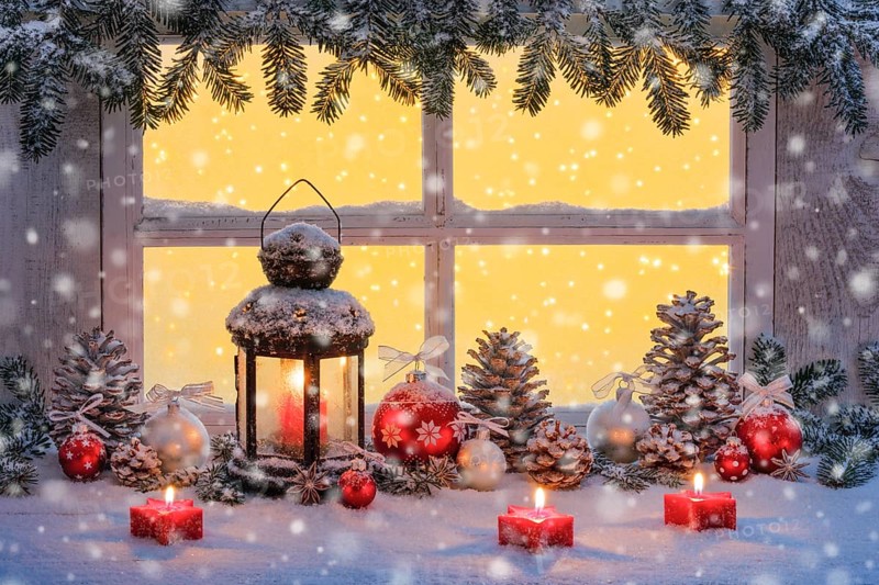 Lantern with Christmas decoration on windowsill