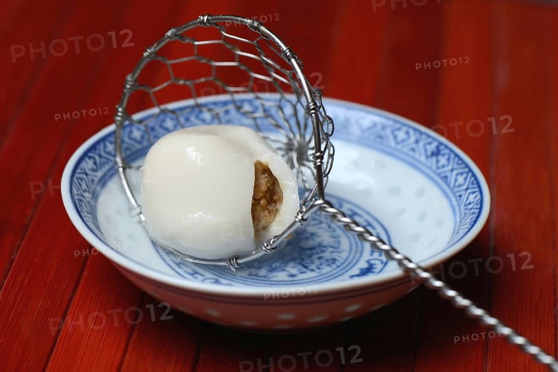 Boiled sticky rice balls with peanut filling