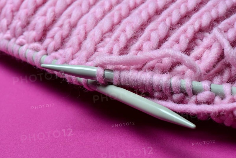 Knitted wool with knitting needles