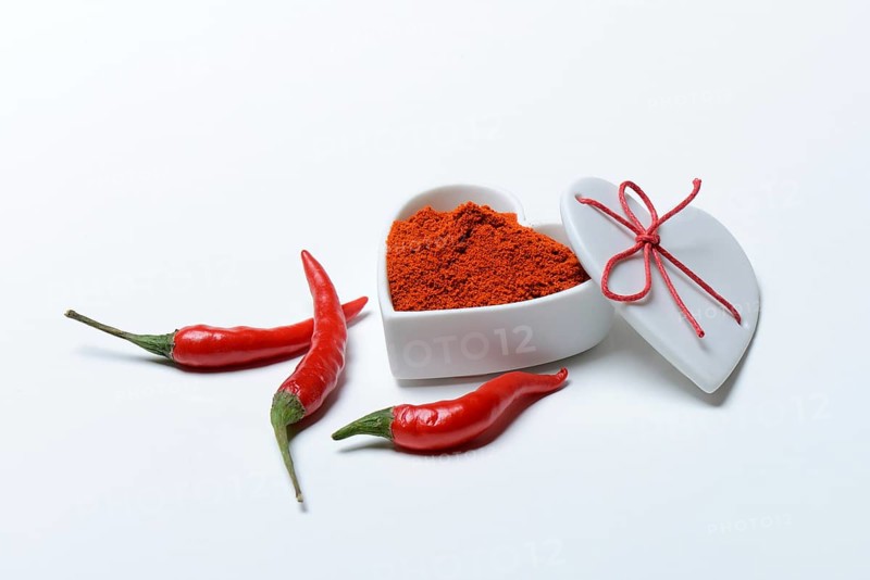 Chili powder in bowl with heart shape