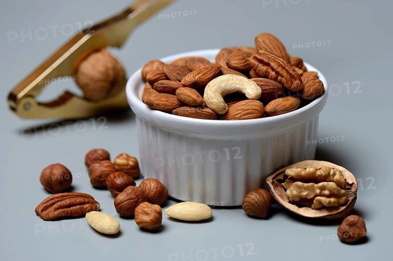 Mixed nuts in shell and nutcracker