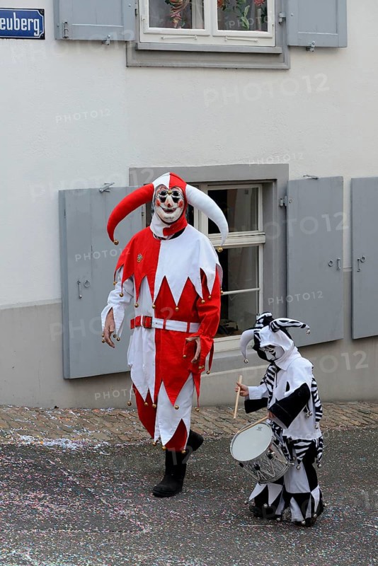 ( Basler Fasnacht) Carnivalist and child with drum, Basel, Switzerland, Europe