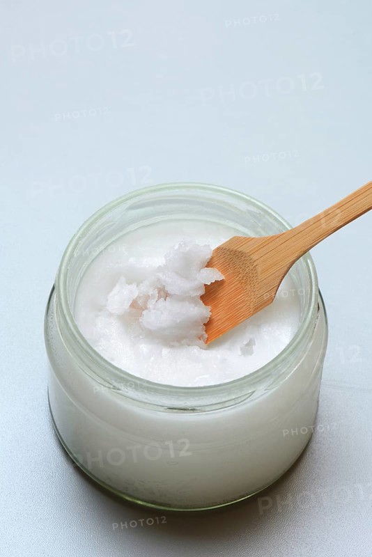 Coconut oil with bamboo spatula