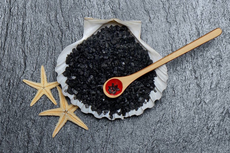 Black Hawaiian salt in shell with spoon