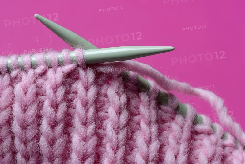 Knitted wool with knitting needles