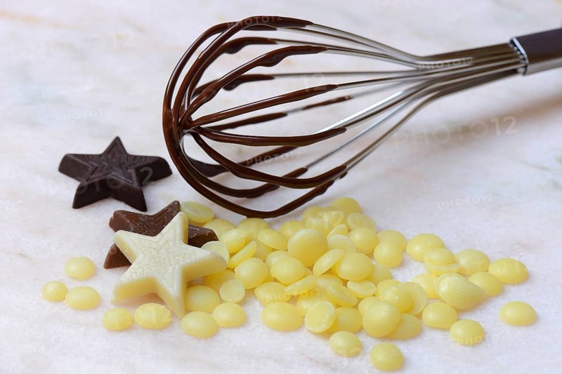 Cocoa butter and chocolate stars with whisk