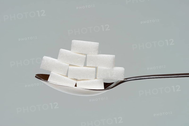 Sugar cubes in tablespoon