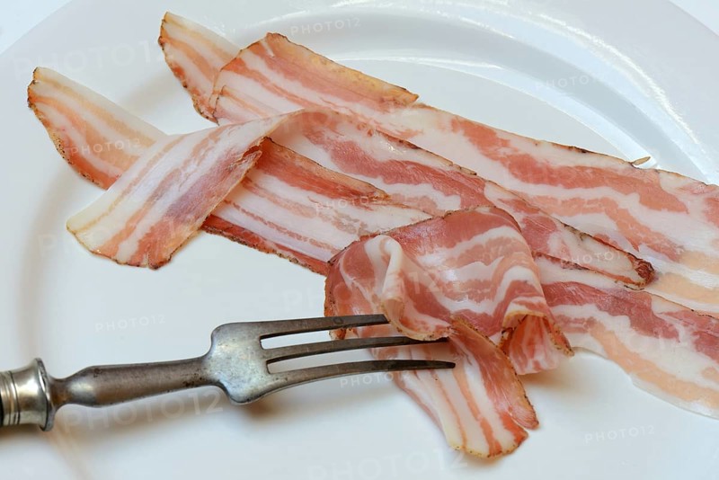 Bacon on plate with fork