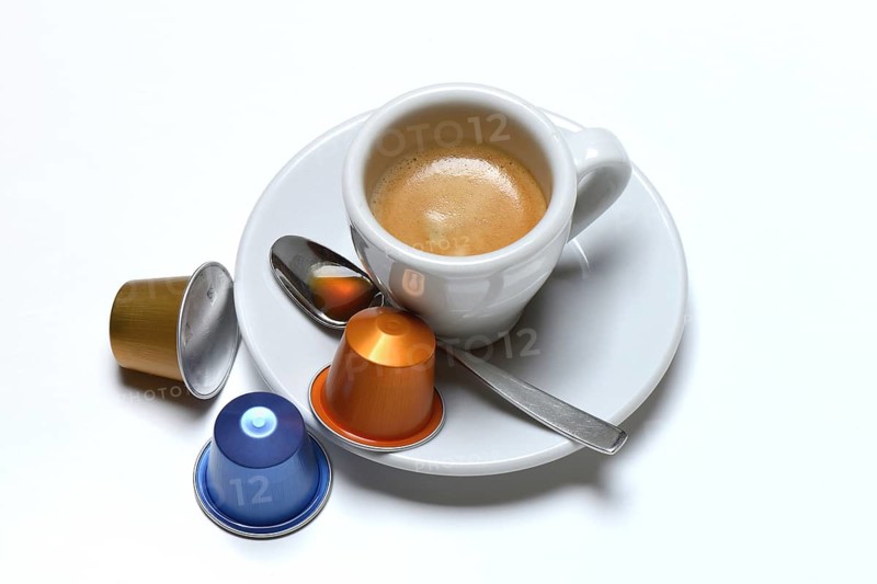 Coffee capsules and coffee cup with espresso