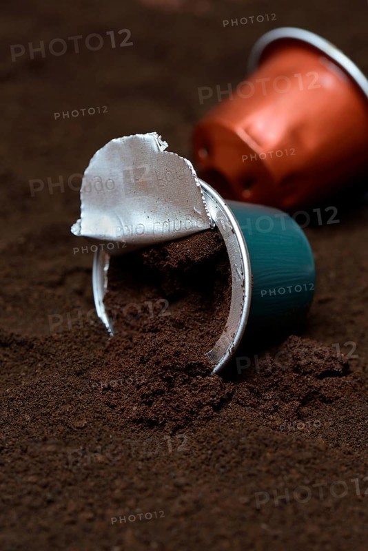 Opened coffee capsule and coffee powder