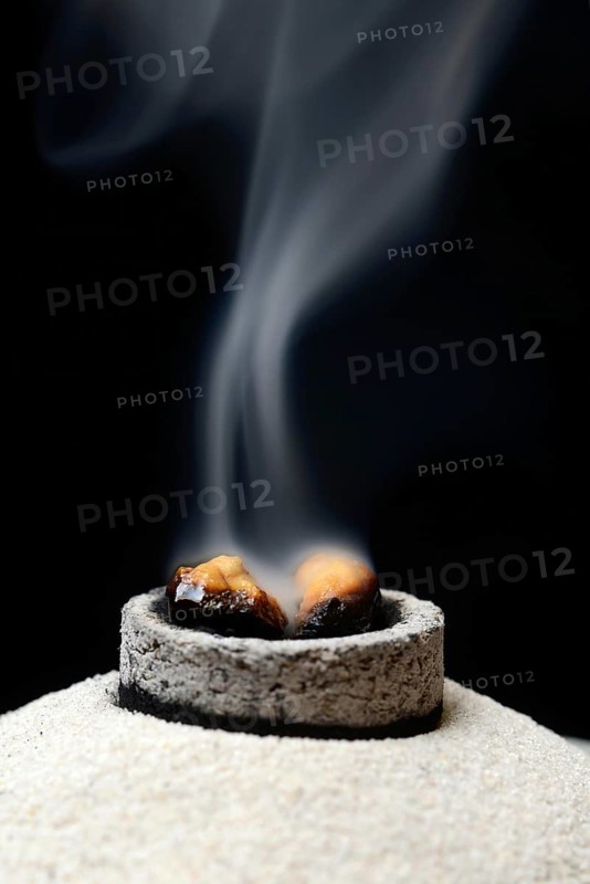 Incense is burned with the help of smoking coal