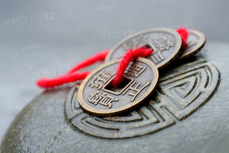 Chinese lucky coins on stone with seal