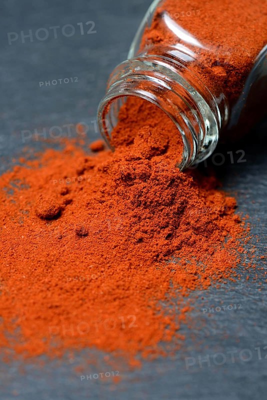 Paprika powder in glass bottle