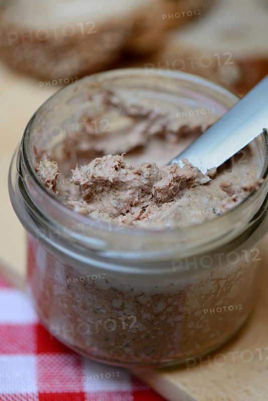 Liver sausage in glass with knife