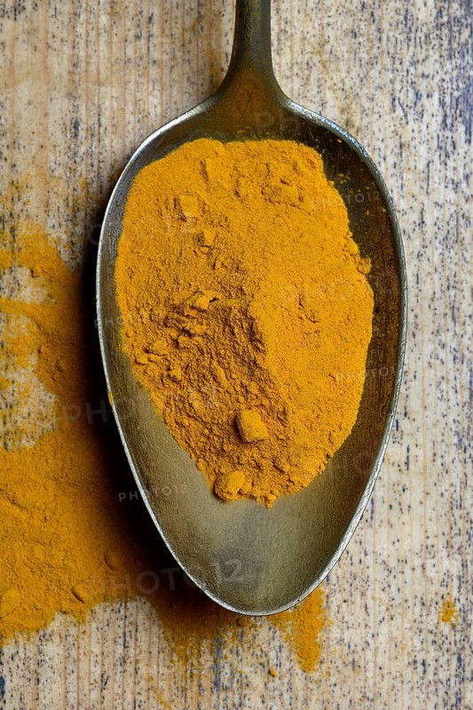 Curcuma powder in spoon
