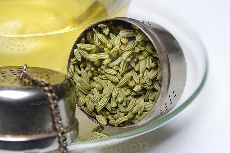 Fennel tea in cup and fennel seeds in spoon