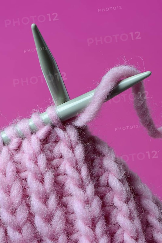 Knitted wool with knitting needles