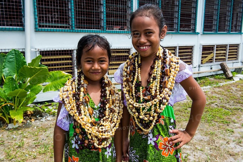 Two Girls with necklaces made of shells