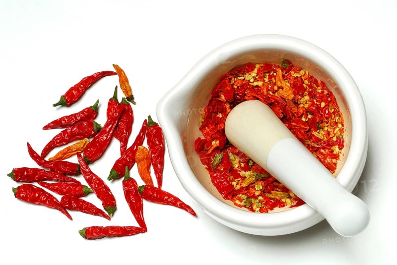 Dried chilli peppers in grating bowl