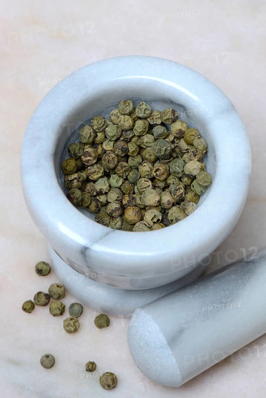 Green malabar pepper in mortar