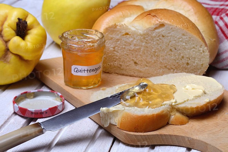 Slice of butter plait with quince jelly