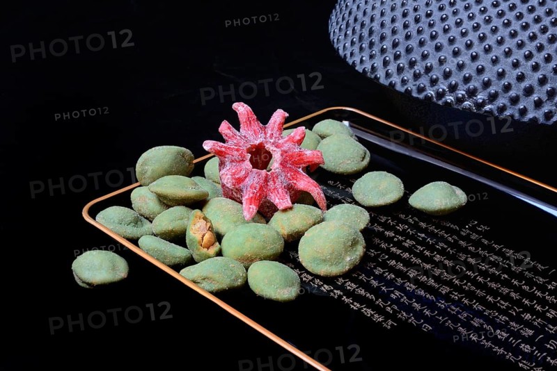 Wasabi peanuts and candied hibiscus flower