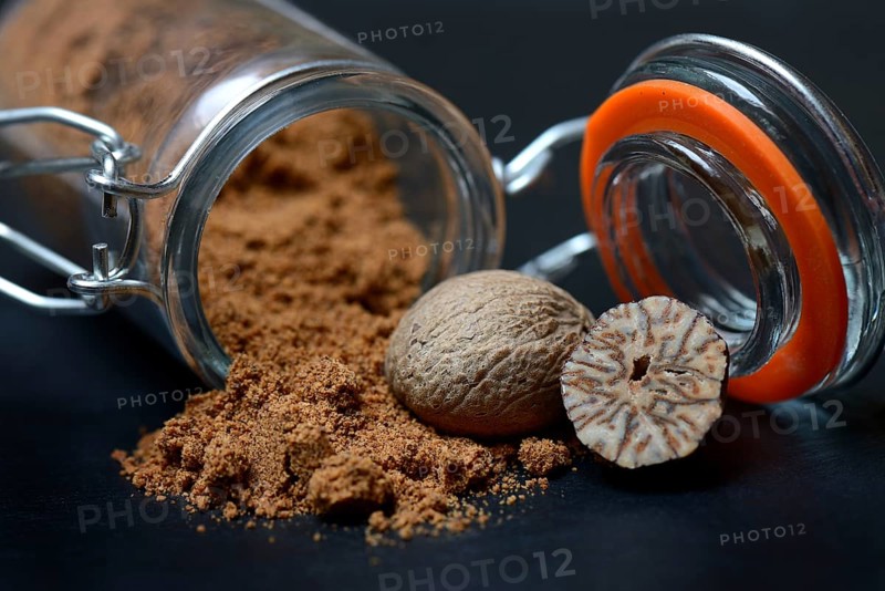 Nutmegs and nutmeg powder in glass containers